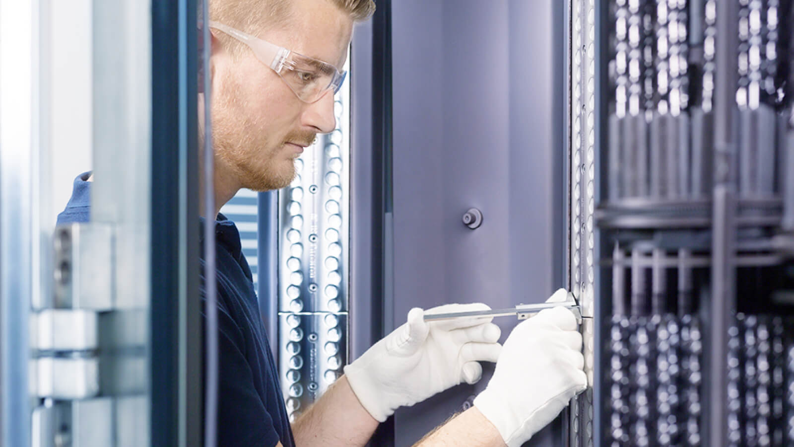 Man attaches a target in a coating system