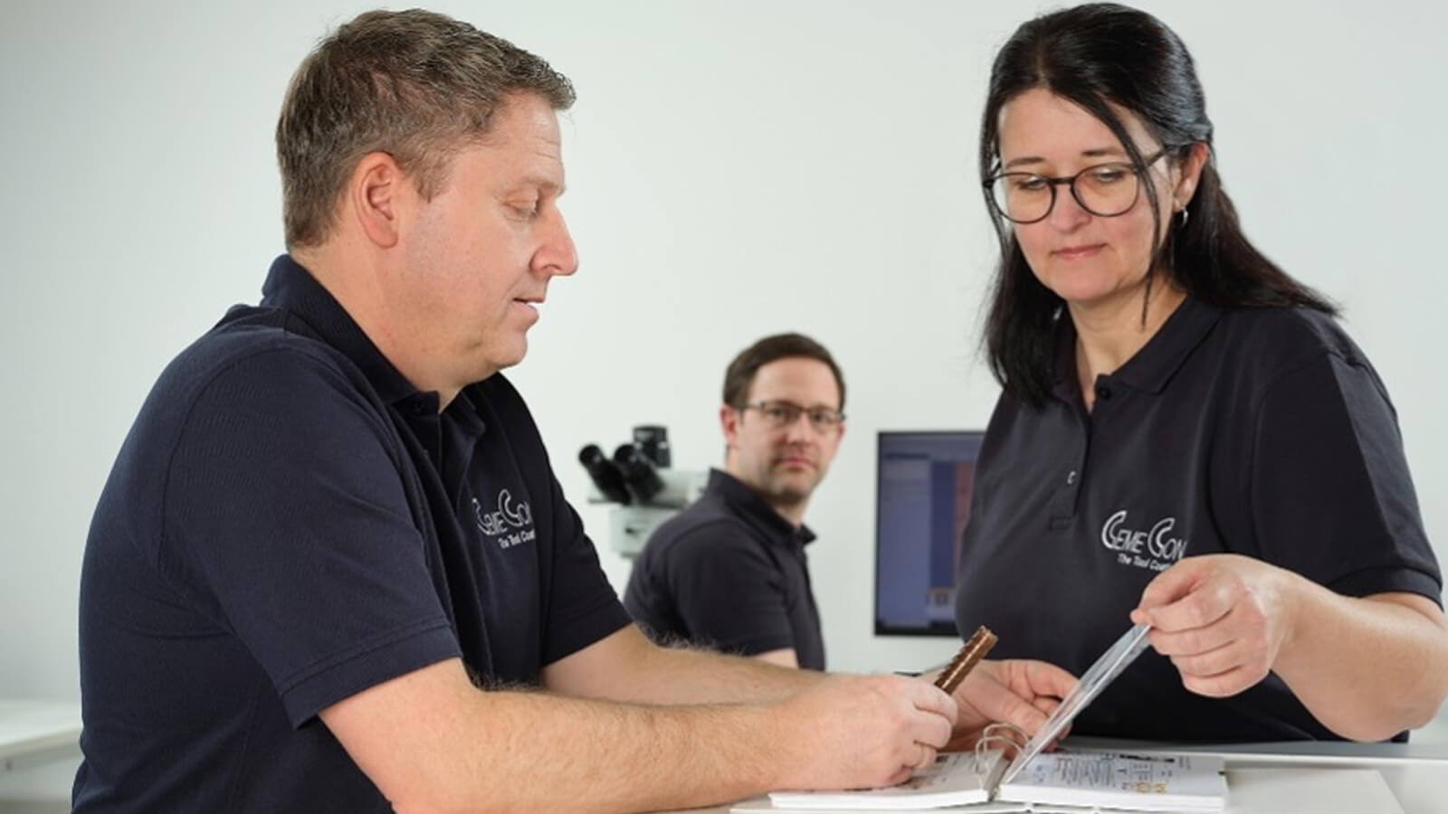 CemeCon employees coordinating an individual customer order for tool coating in the coating center